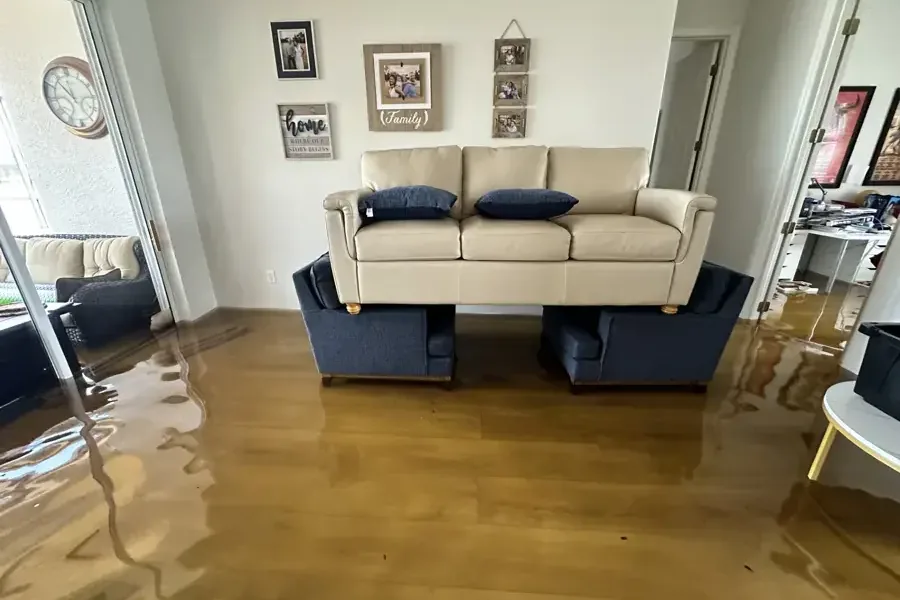 Storm floodwater across the living room floor of a home
